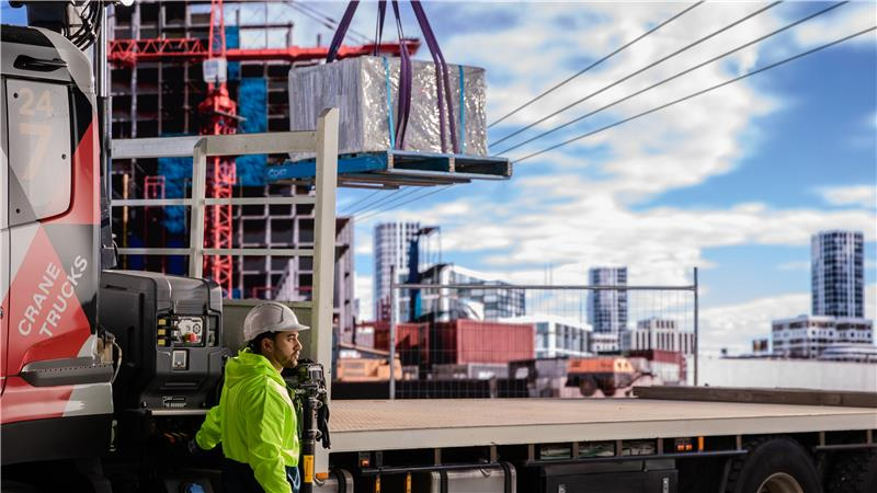 Look Up and Live - Work Safely around the network - construction worker looking up at a building