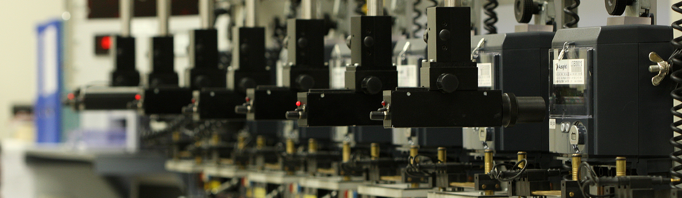 Electricity meters lined up on a wall